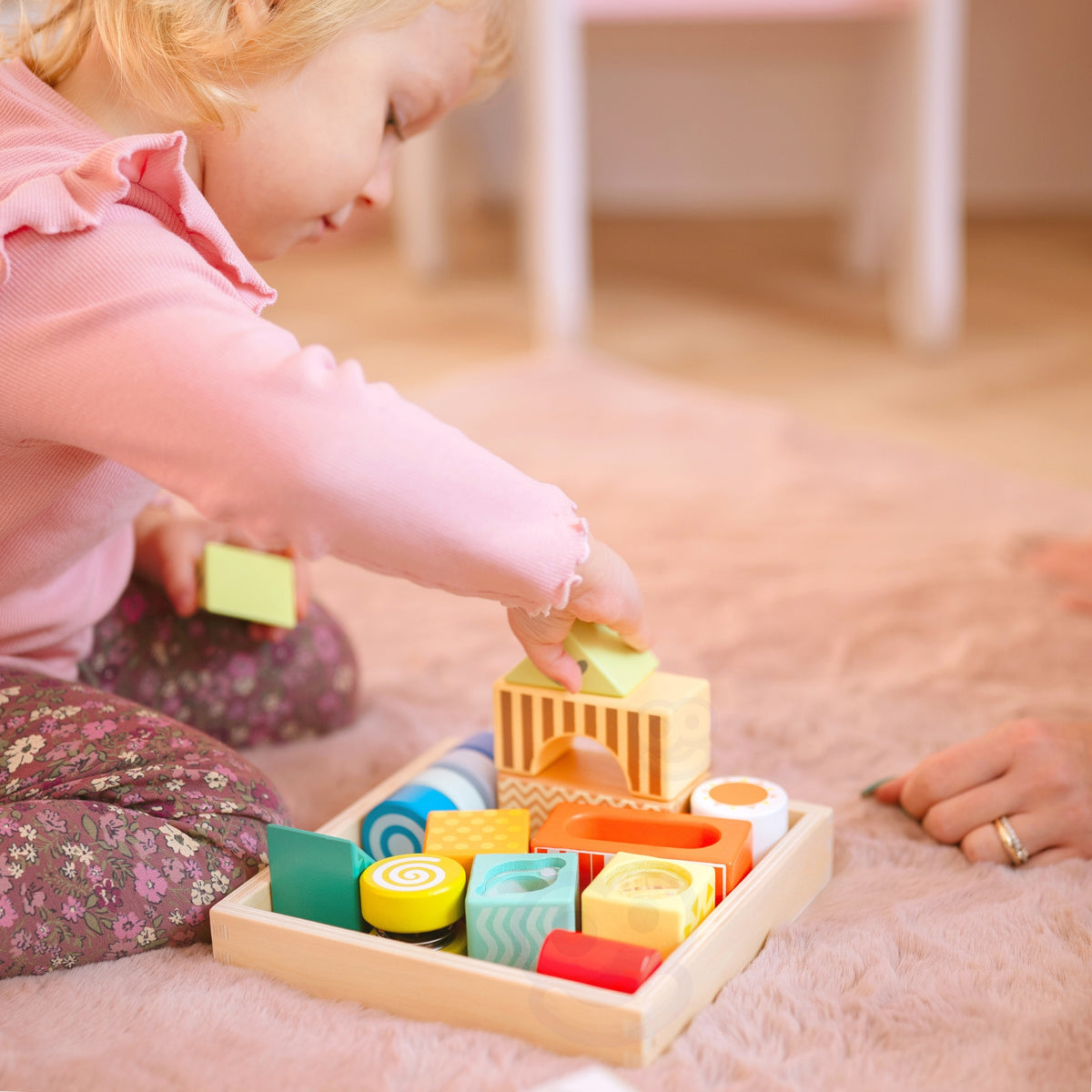 Fourteen colourful sensory blocks for building and play