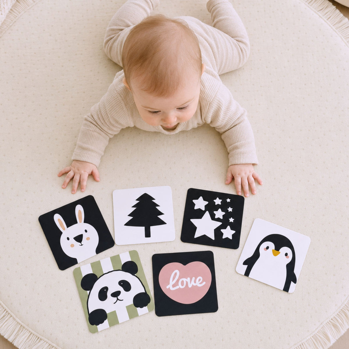 Baby looking at contrast sensory cards from the set