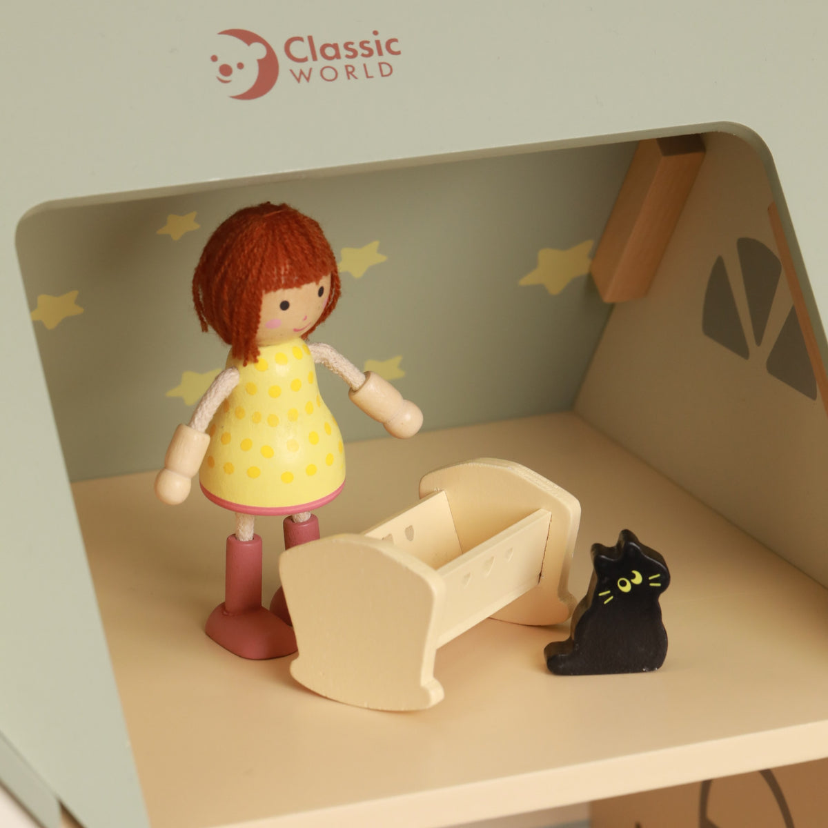 Bērns spēlējas ar Classic World Cozy leļļu māju