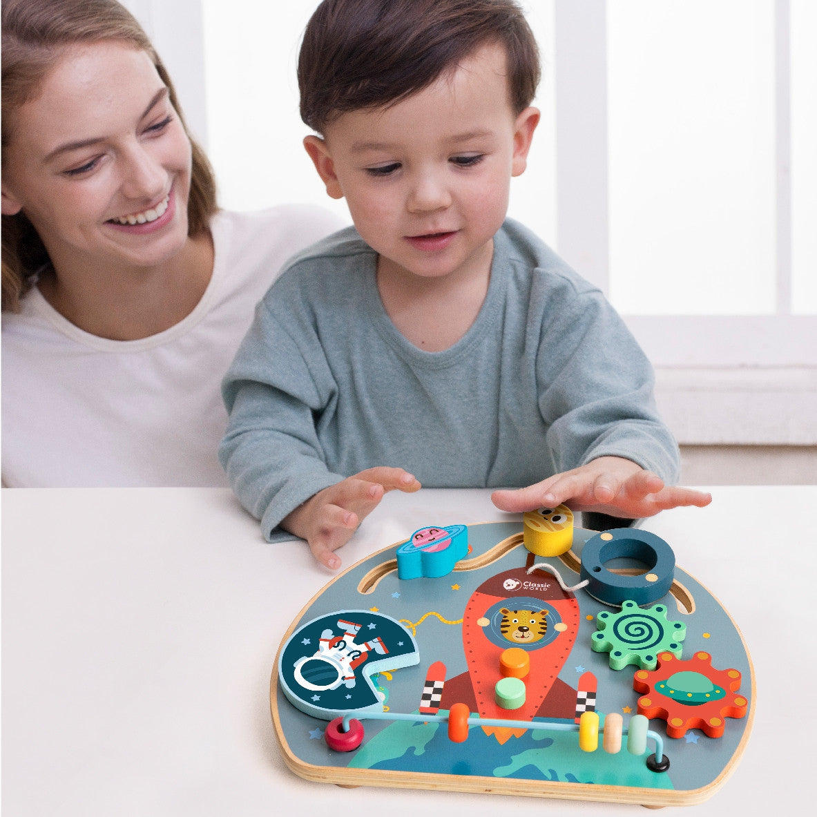 Rocket busy board with bead maze and spinning wheel