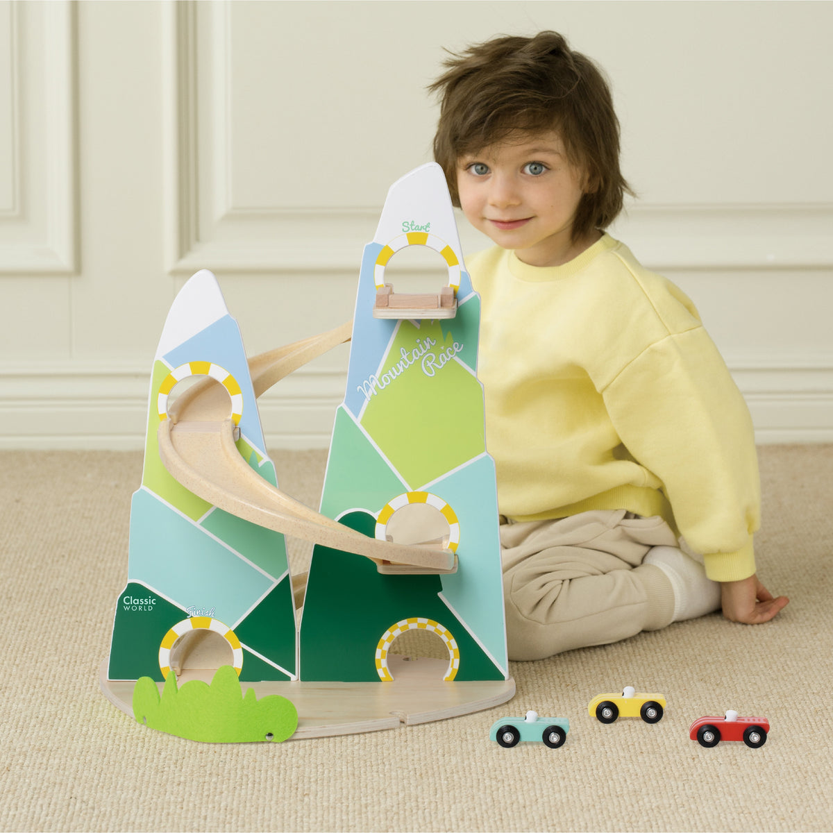 Pastel wooden mountains with zigzag car paths