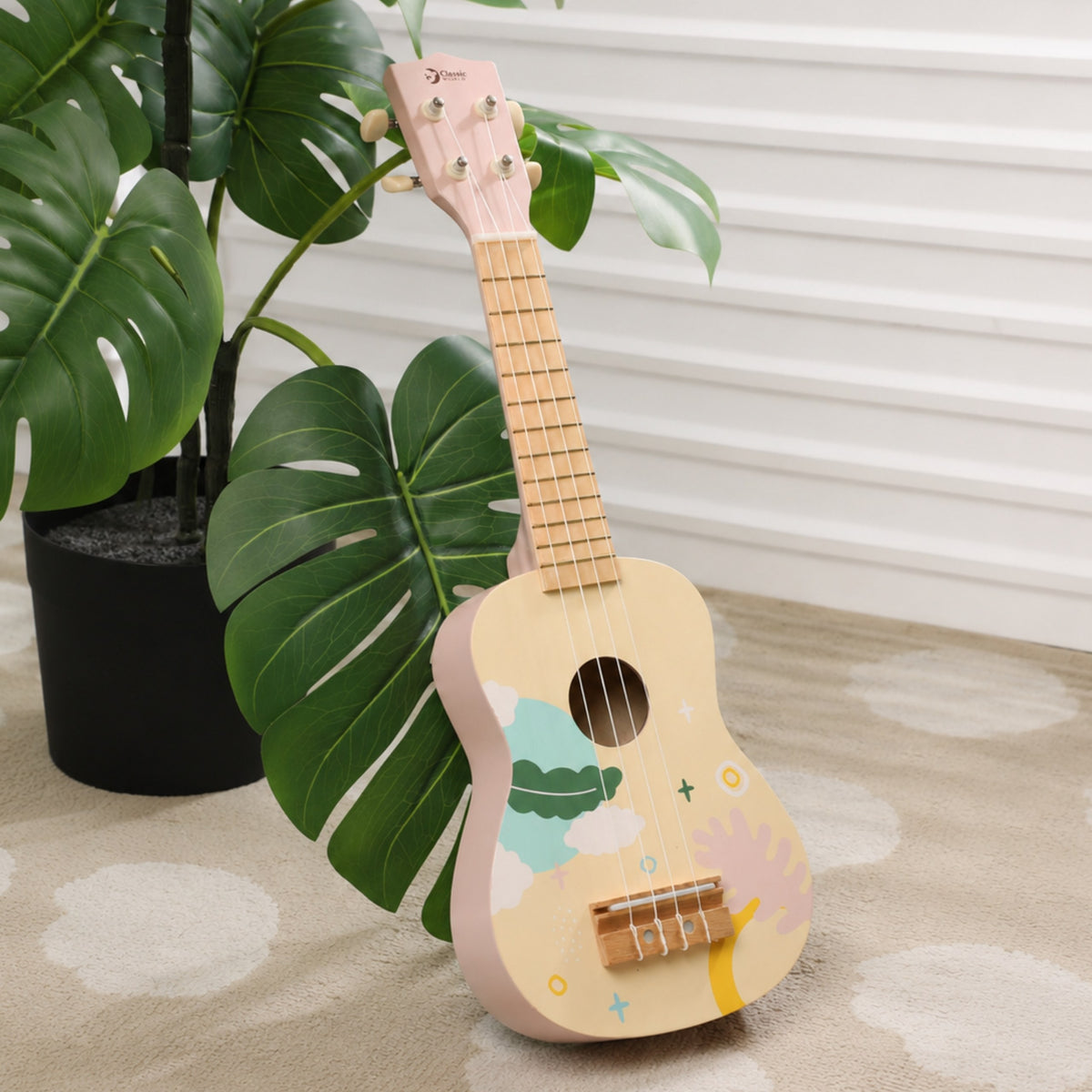 Classic World pink ukulele – child playing