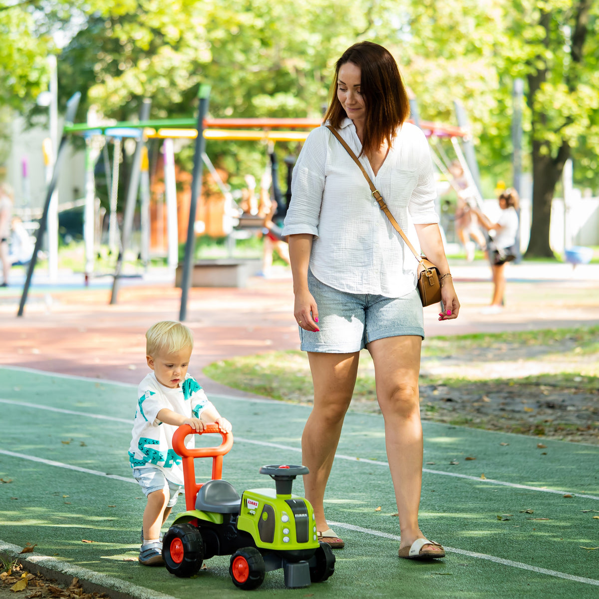 FALK Baby Claas traktors – atzveltne kā rokturis