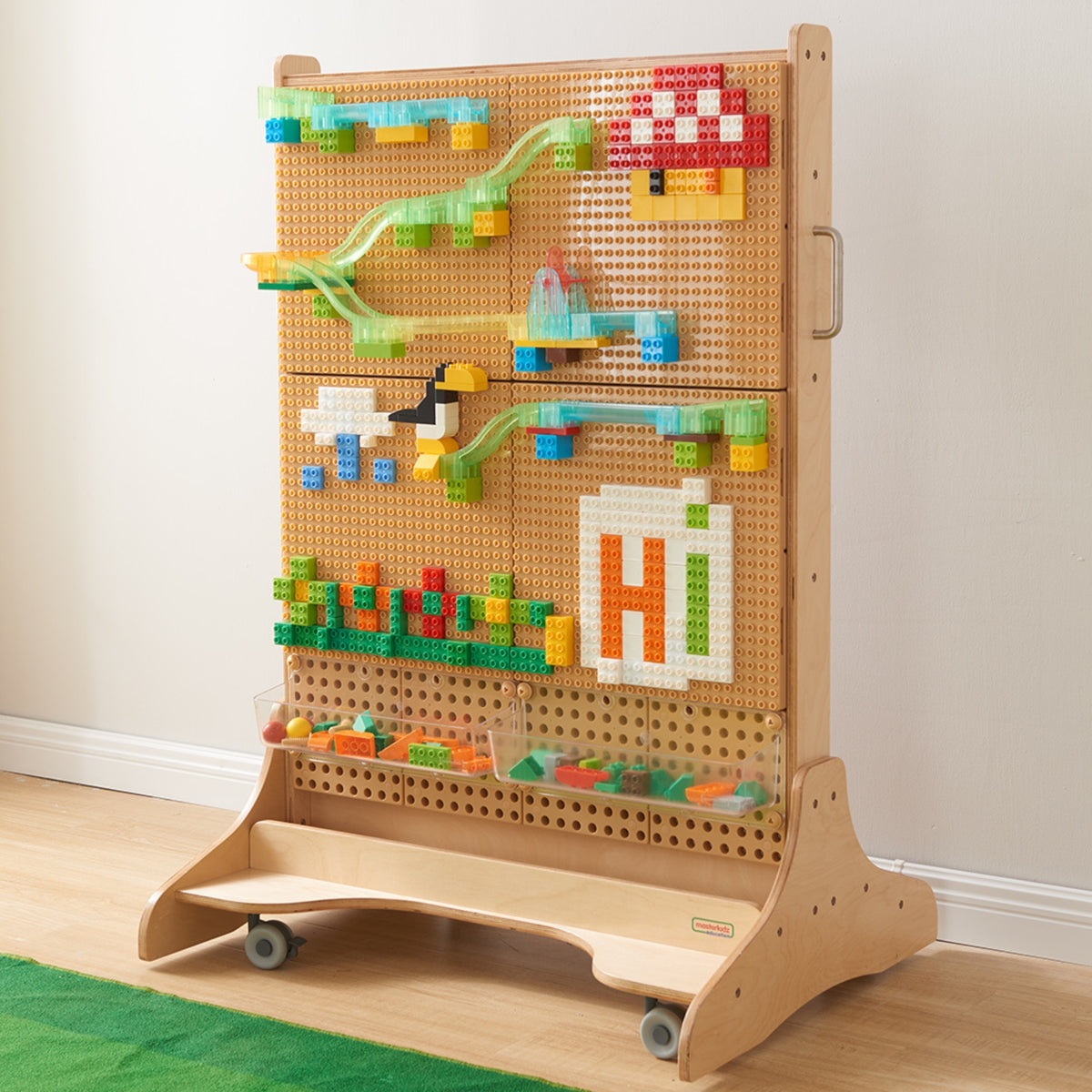 Kids building a marble run from Masterkidz bricks