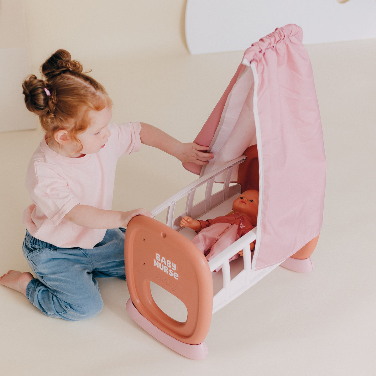 Doll cradle sized for dolls about 42 cm tall