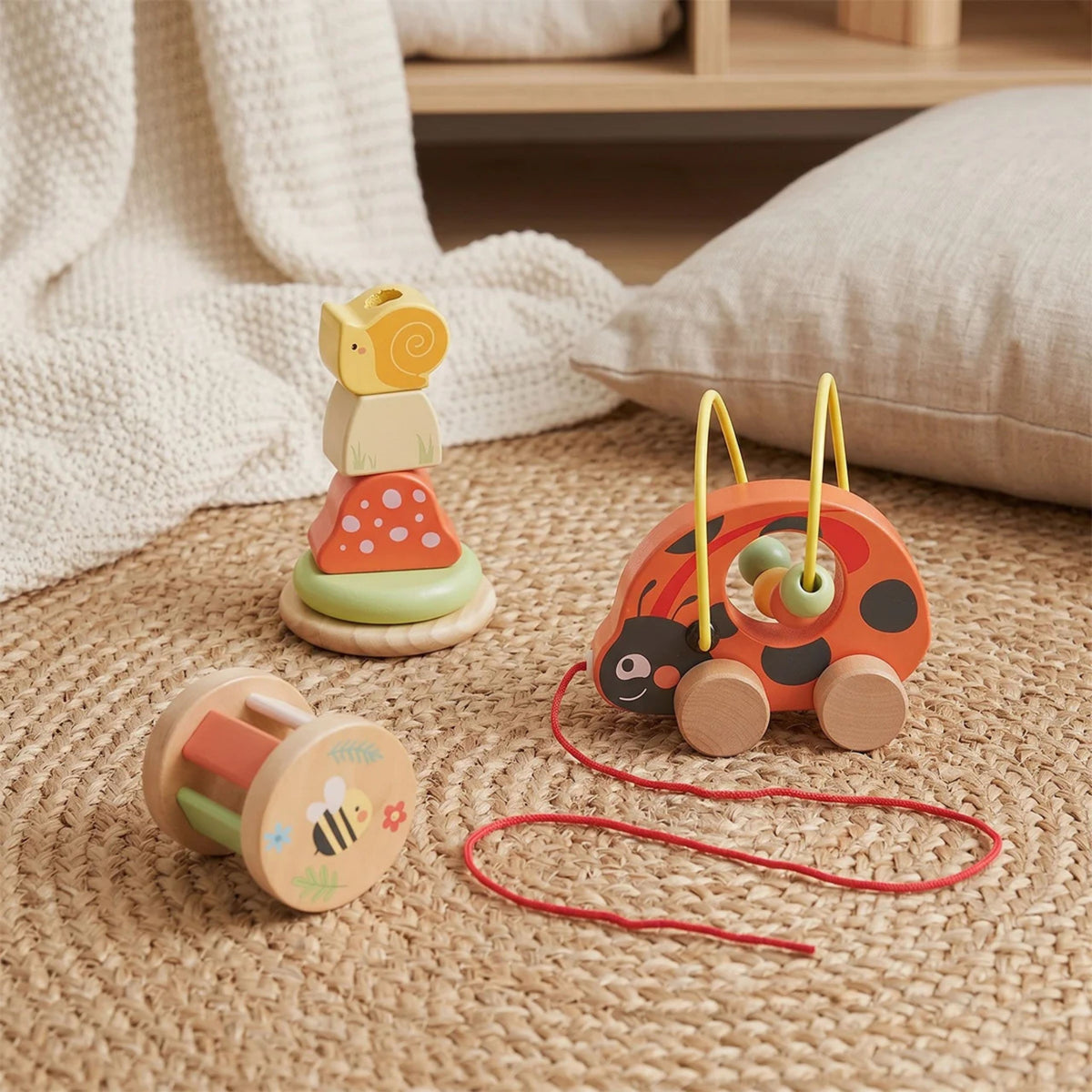 Tooky Toy ladybug set – toddler pulling the ladybug