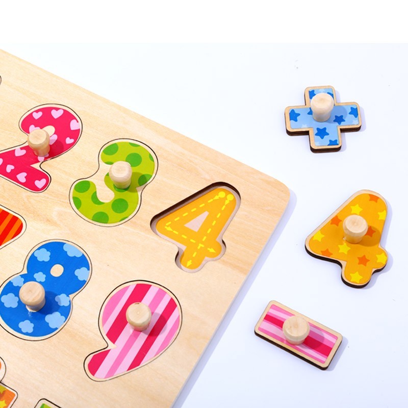 Tooky Toy numbers puzzle – child placing a number