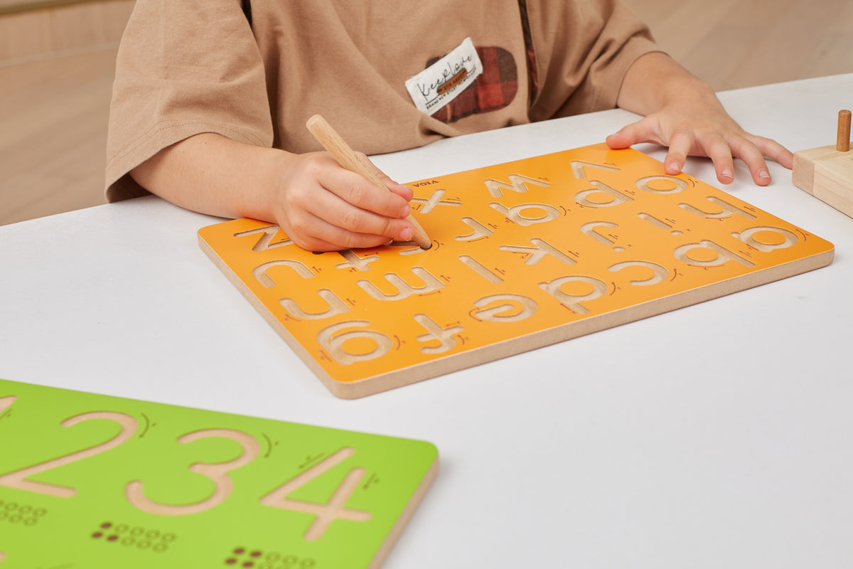 Viga capital letters board – child tracing a letter
