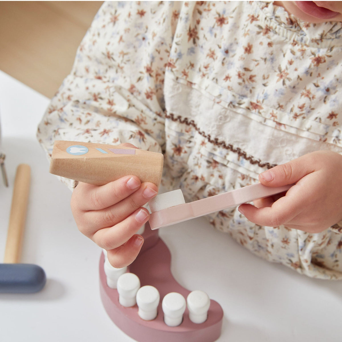 Wooden drill, toothbrush, floss and toothpaste