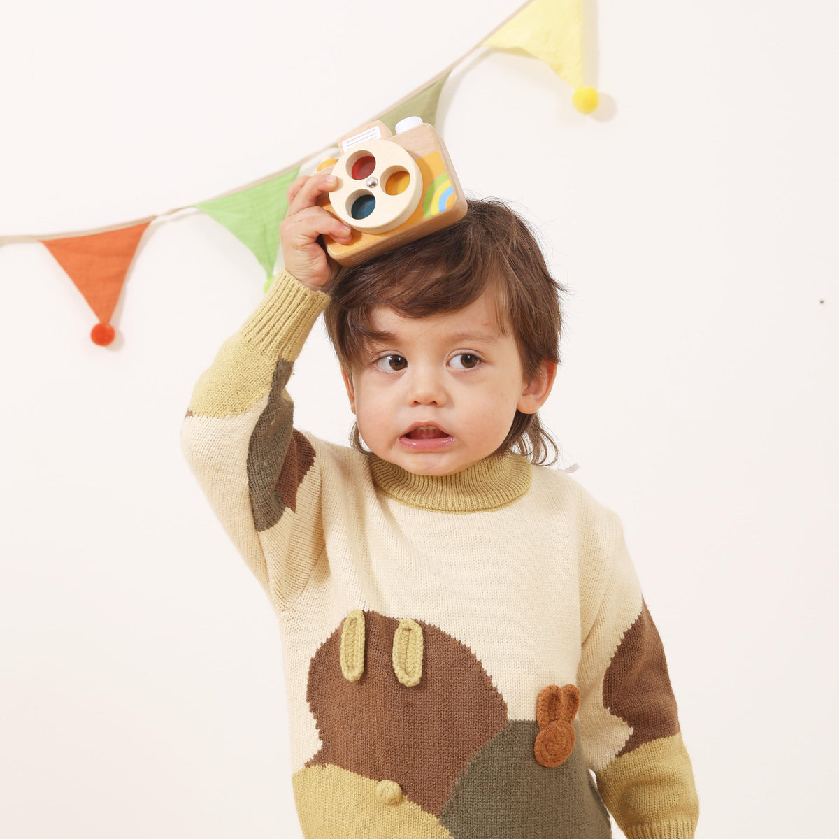 Viga wooden toy camera – toddler taking a photo