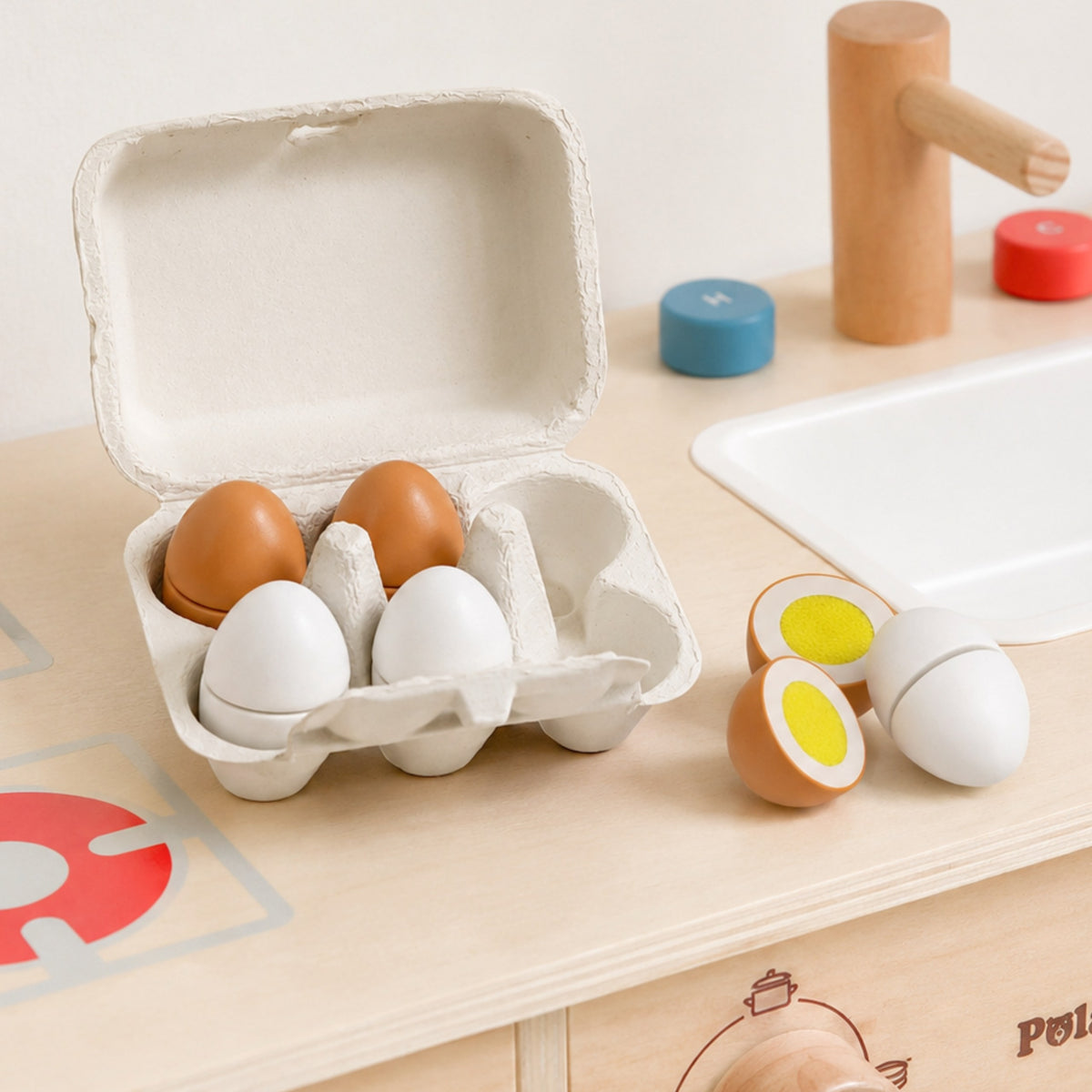 Six wooden eggs sitting in their egg carton