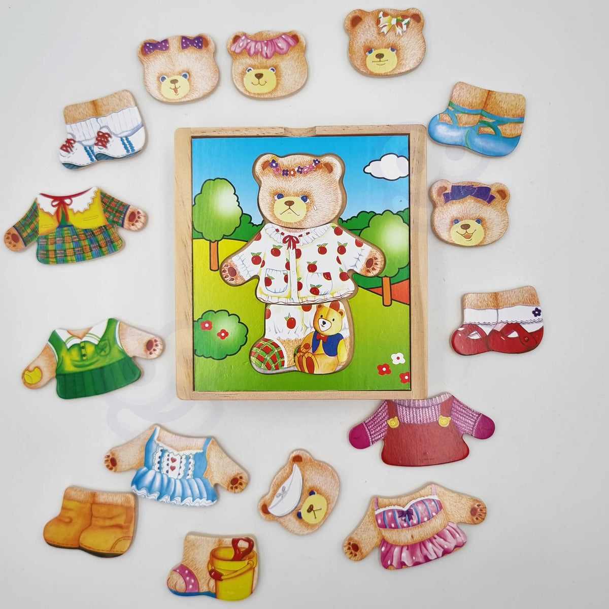 Wooden puzzle pieces – head, outfit and legs of the bear