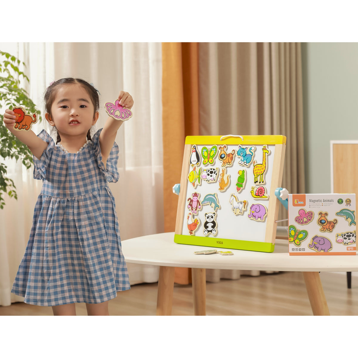 Viga animal magnets – child placing a magnet