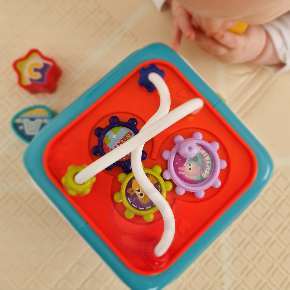 Six sides of the activity cube with textures and tasks
