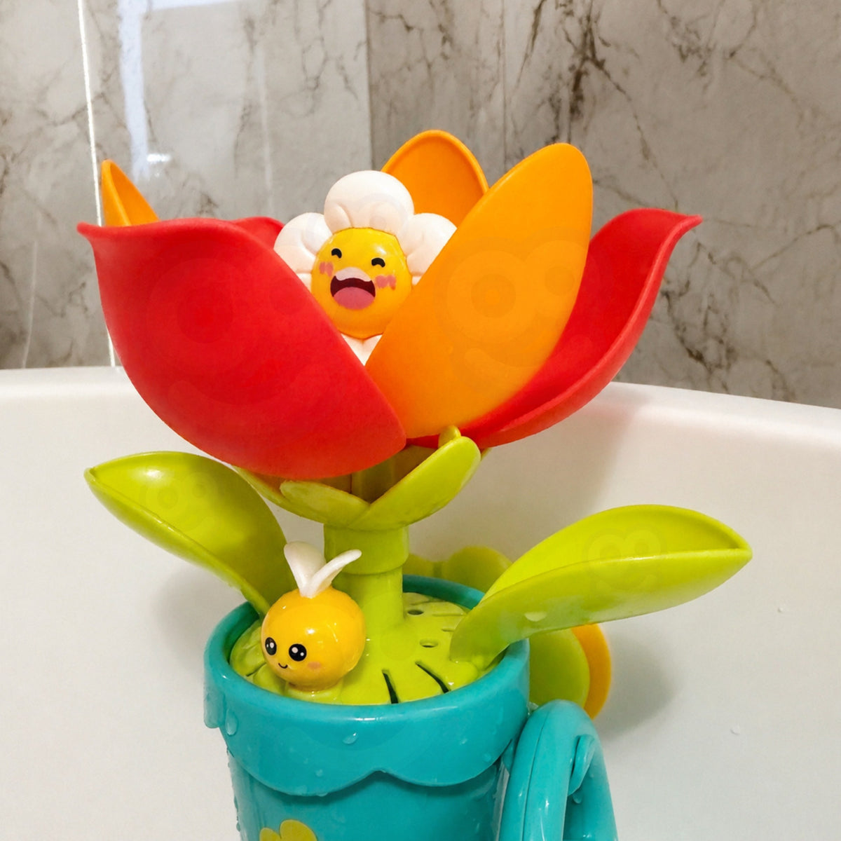 Baby watering the bath flower with the watering can