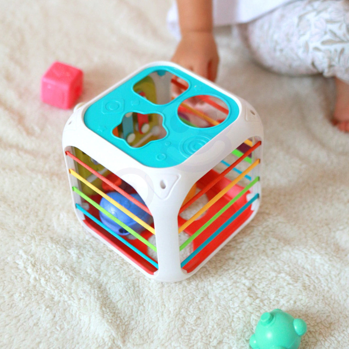 Six shape sorting blocks with hidden bells inside