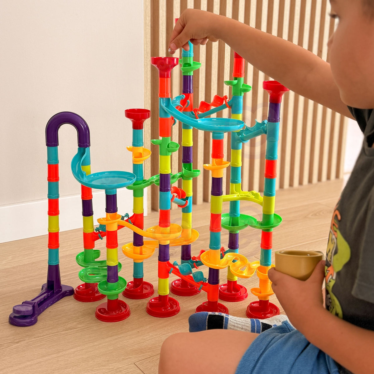Colourful balls rolling down the marble run slides