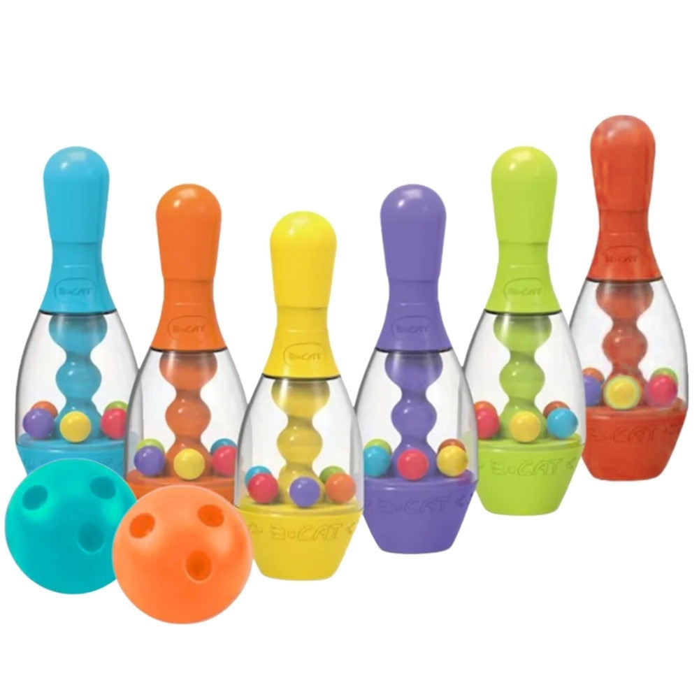 Child rolling a soft ball at the sensory pins