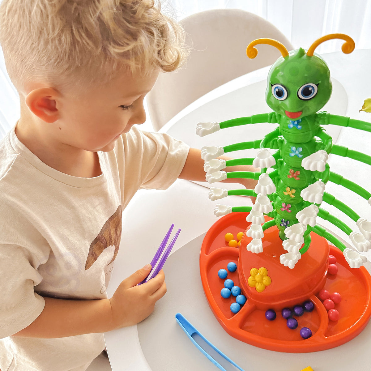 Dancing caterpillar – coloured balls placed on its feet