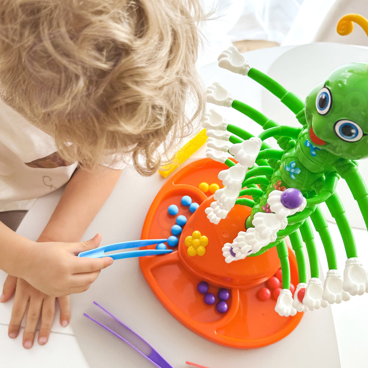 Children playing the dancing caterpillar game together
