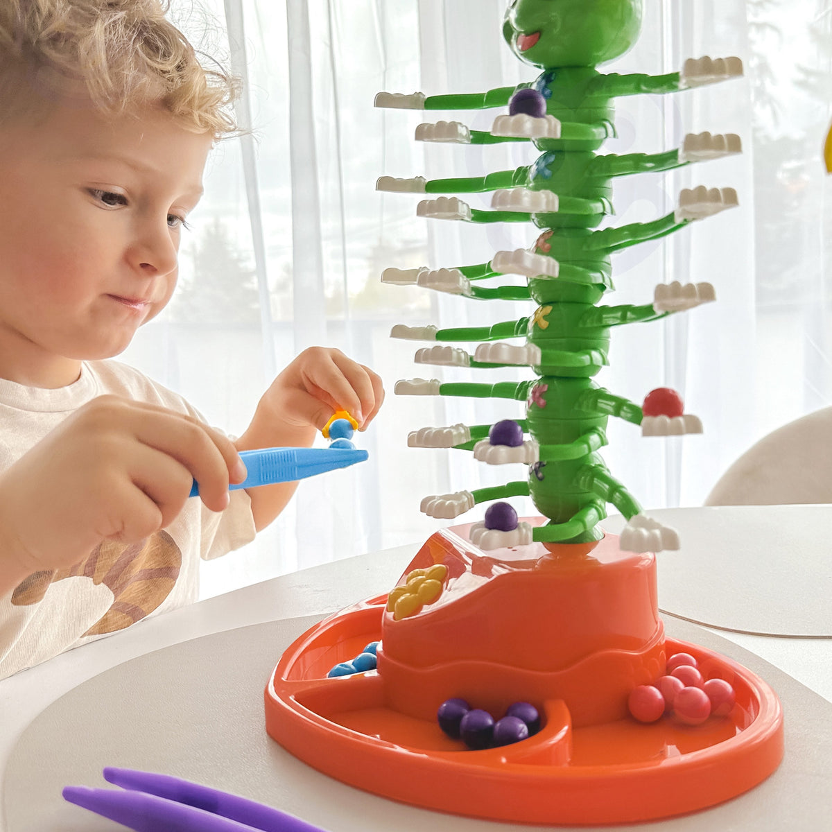 Dancing Caterpillar game box for up to 4 players