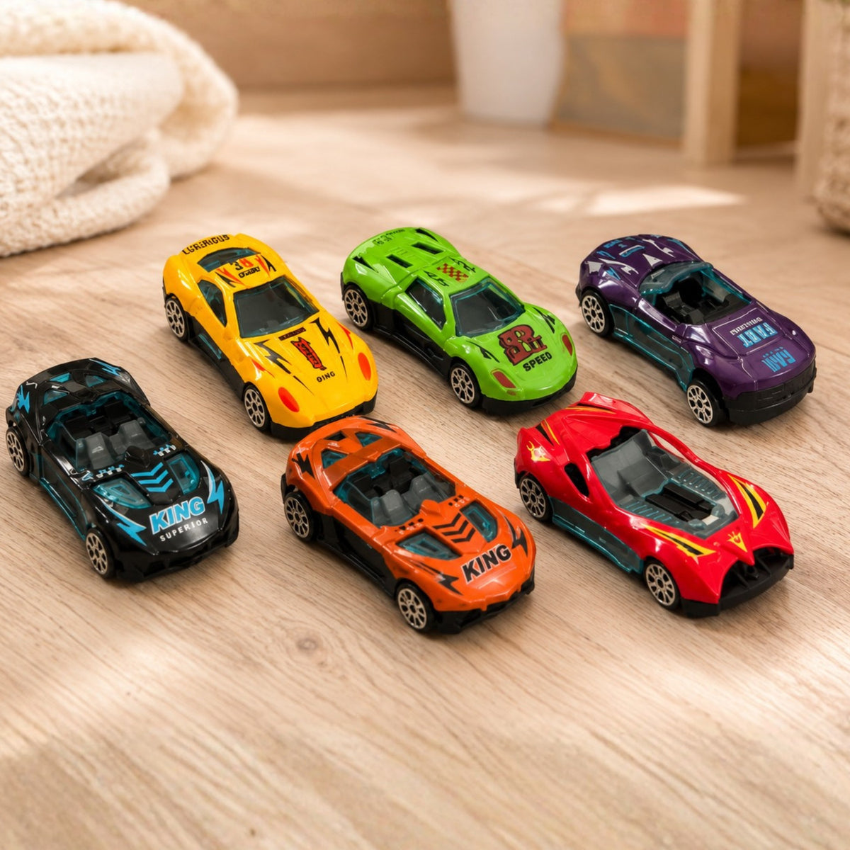 Twelve small toy cars included with the transporter