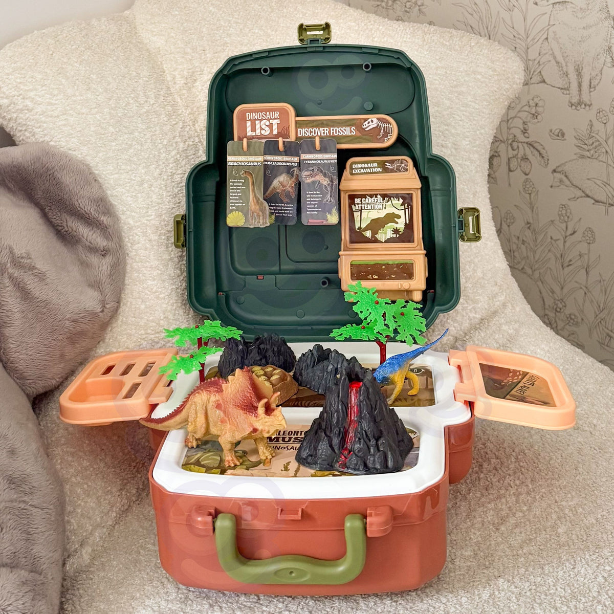 Prehistoric scene with volcano, trees and dinosaur eggs
