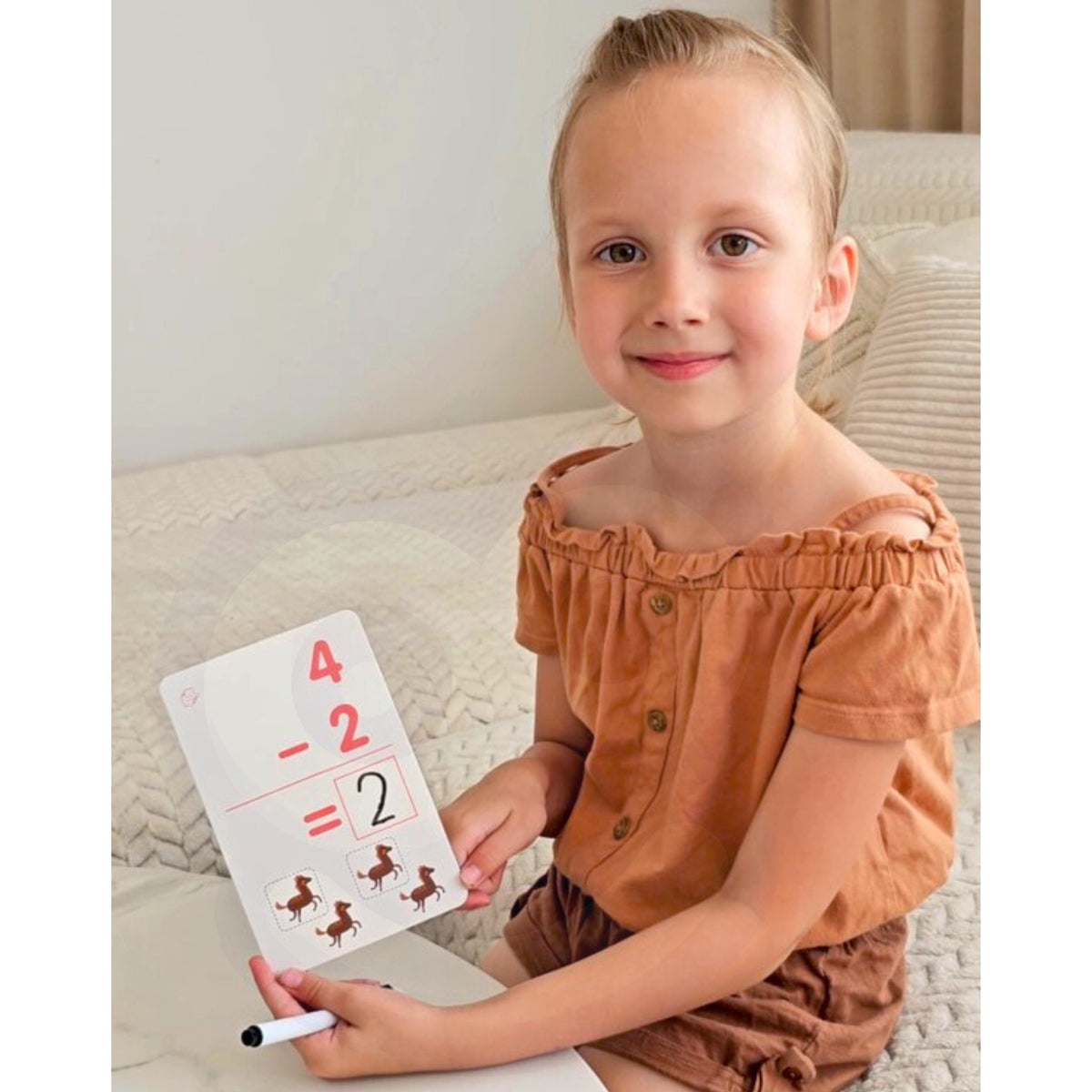 Woopie maths flashcards – child solving a sum