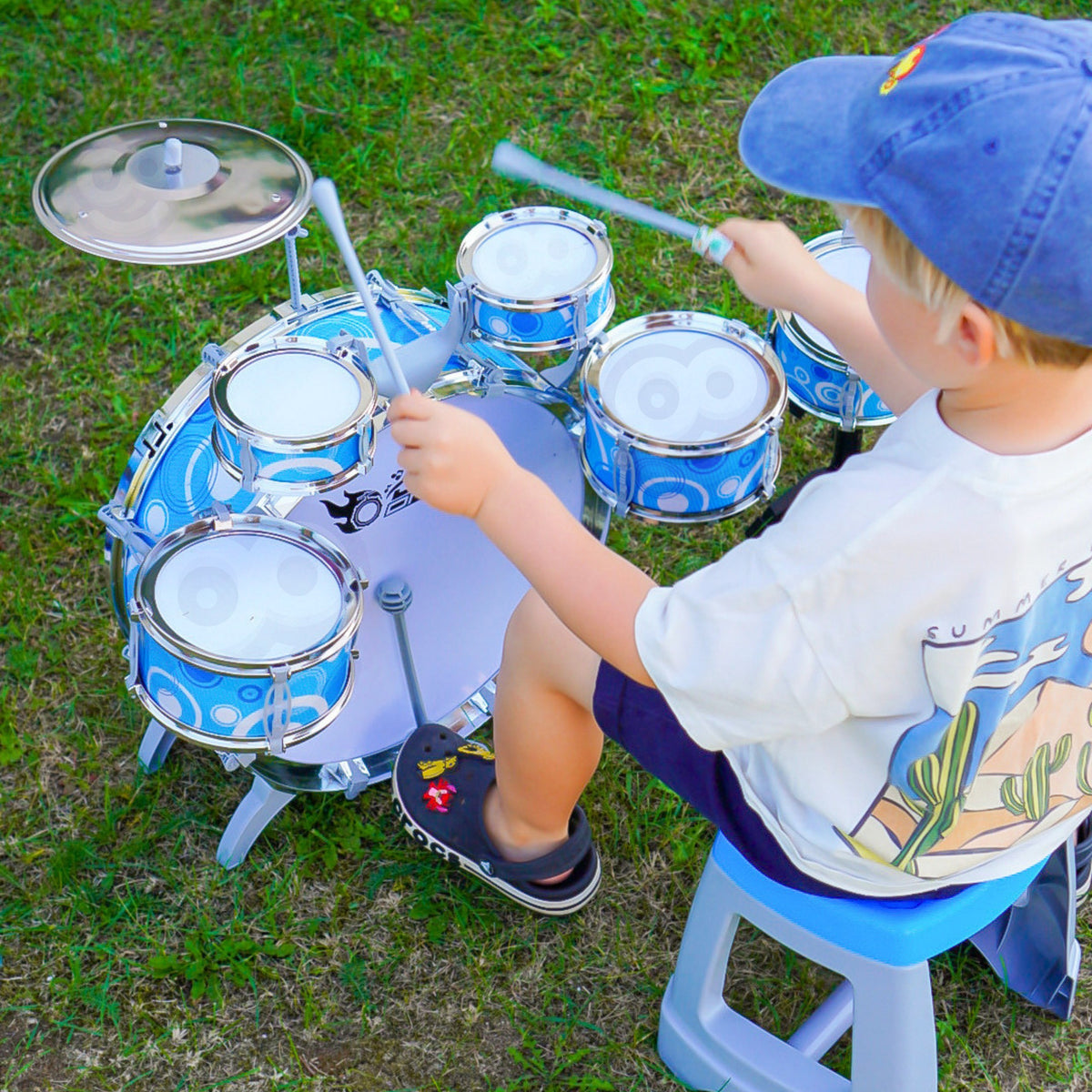 Medium and small toy drums with drumsticks