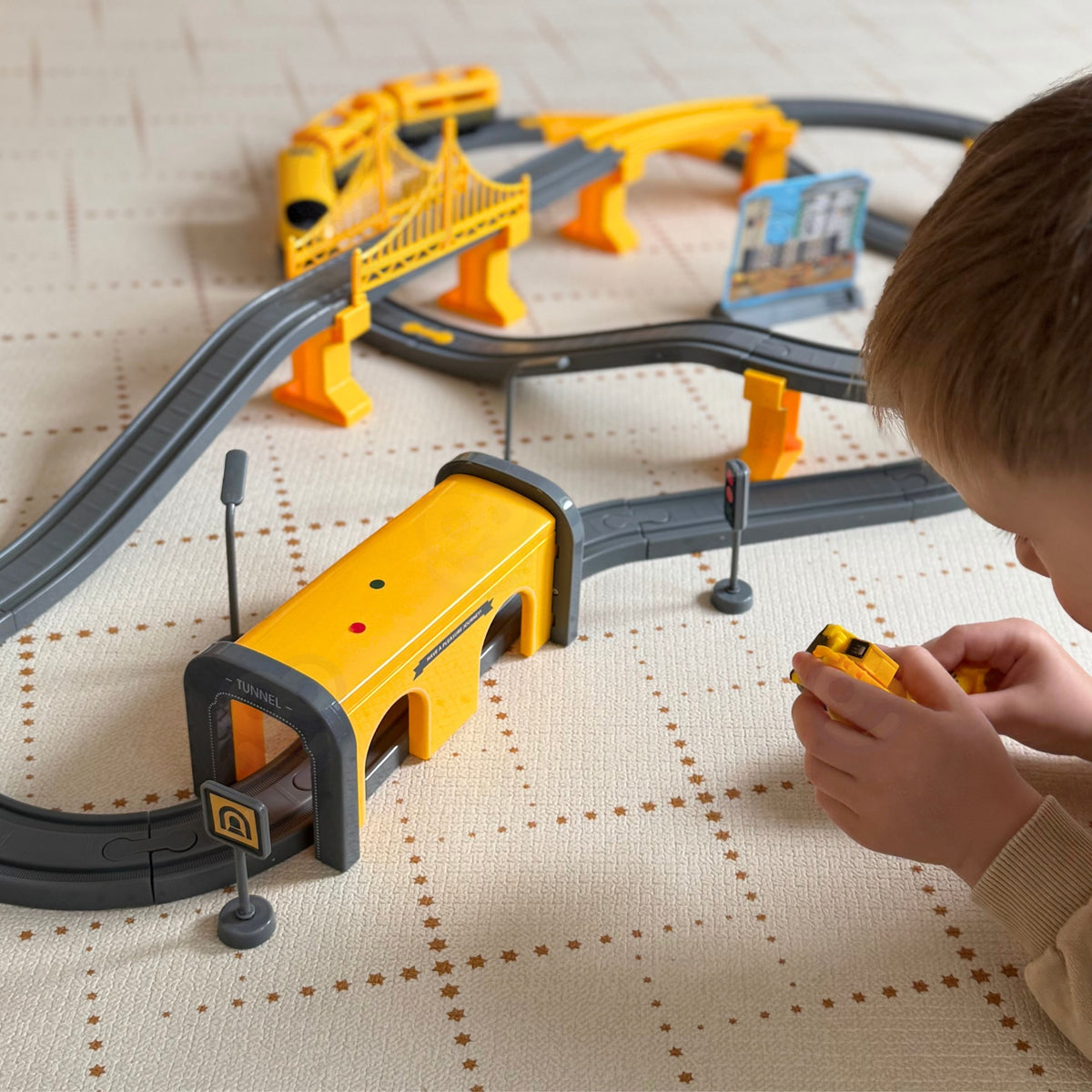 Construction vehicles and worker figure by the track