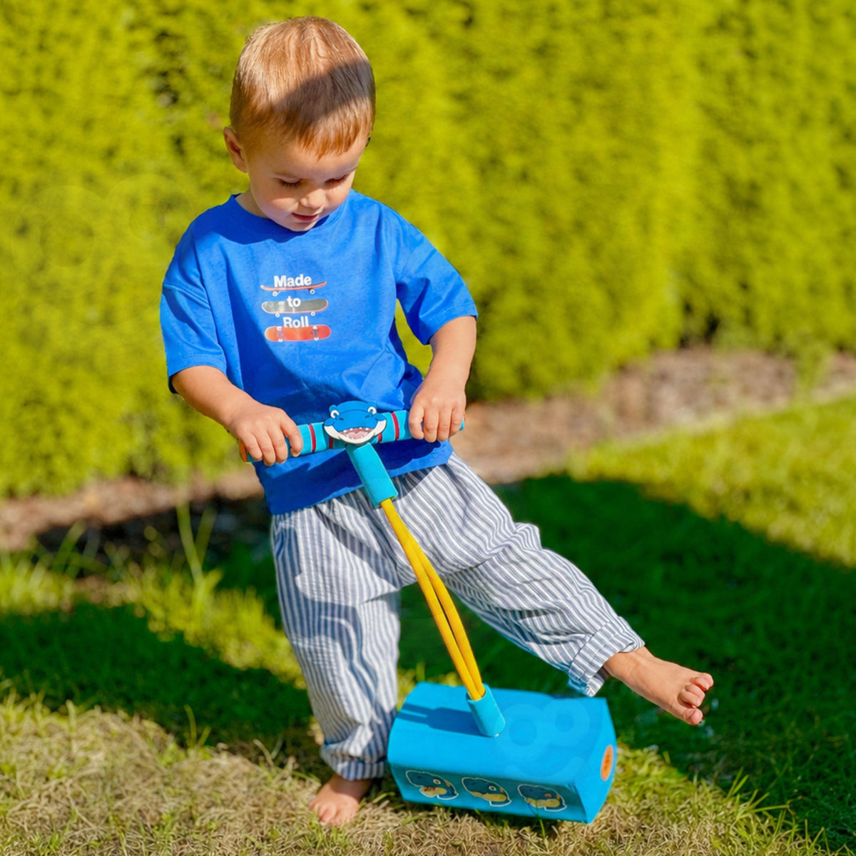 Woopie blue dinosaur pogo jumper – child bouncing like a dino