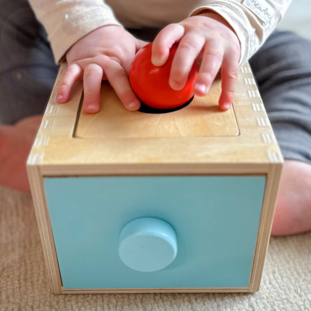 Montessori drawer sorter – pieces slide into the drawer below