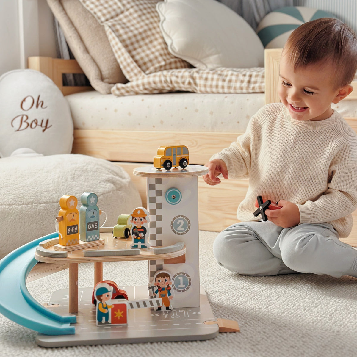 Wooden toy garage – blue spiral ramp connecting the levels