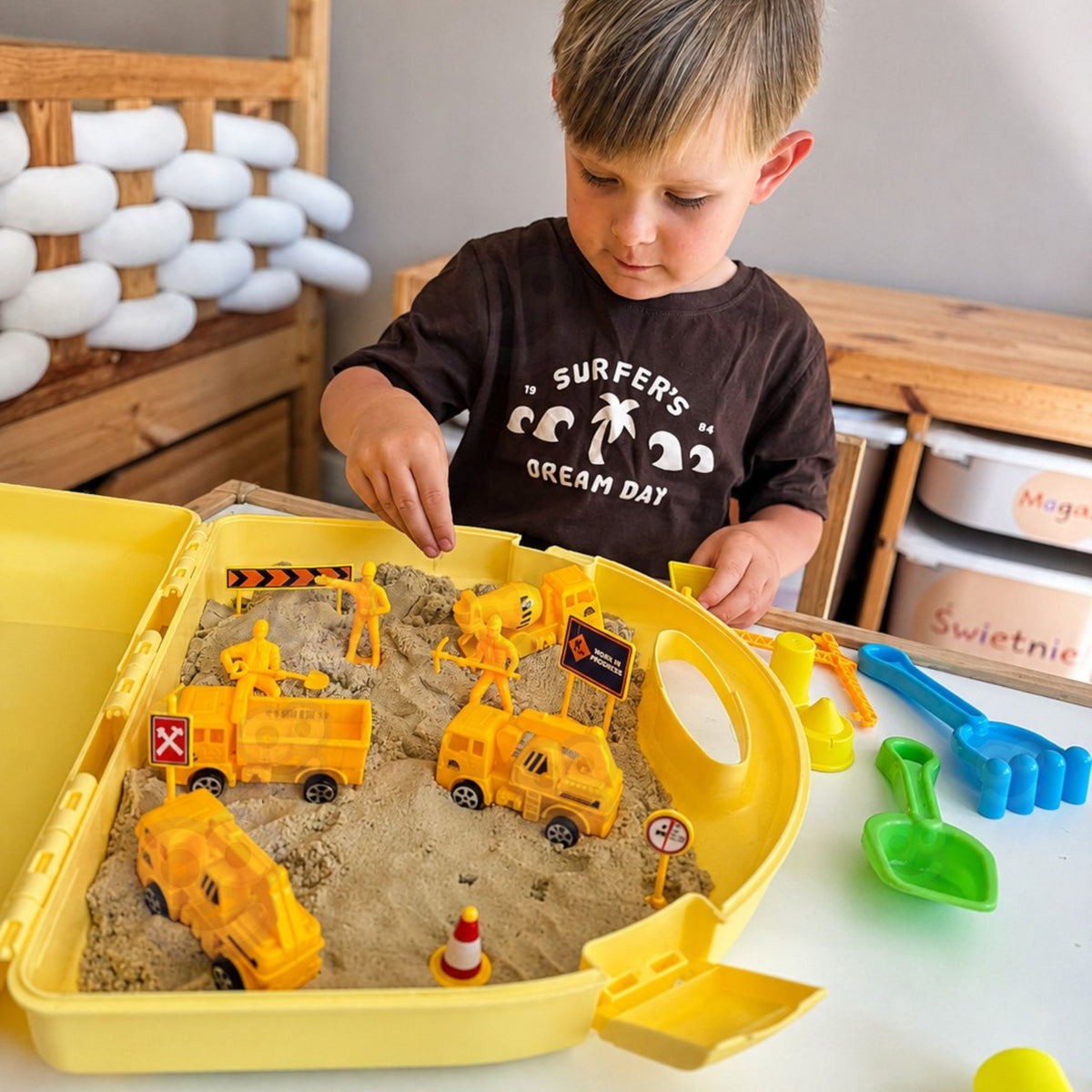 Case opened into a sandbox with kinetic sand