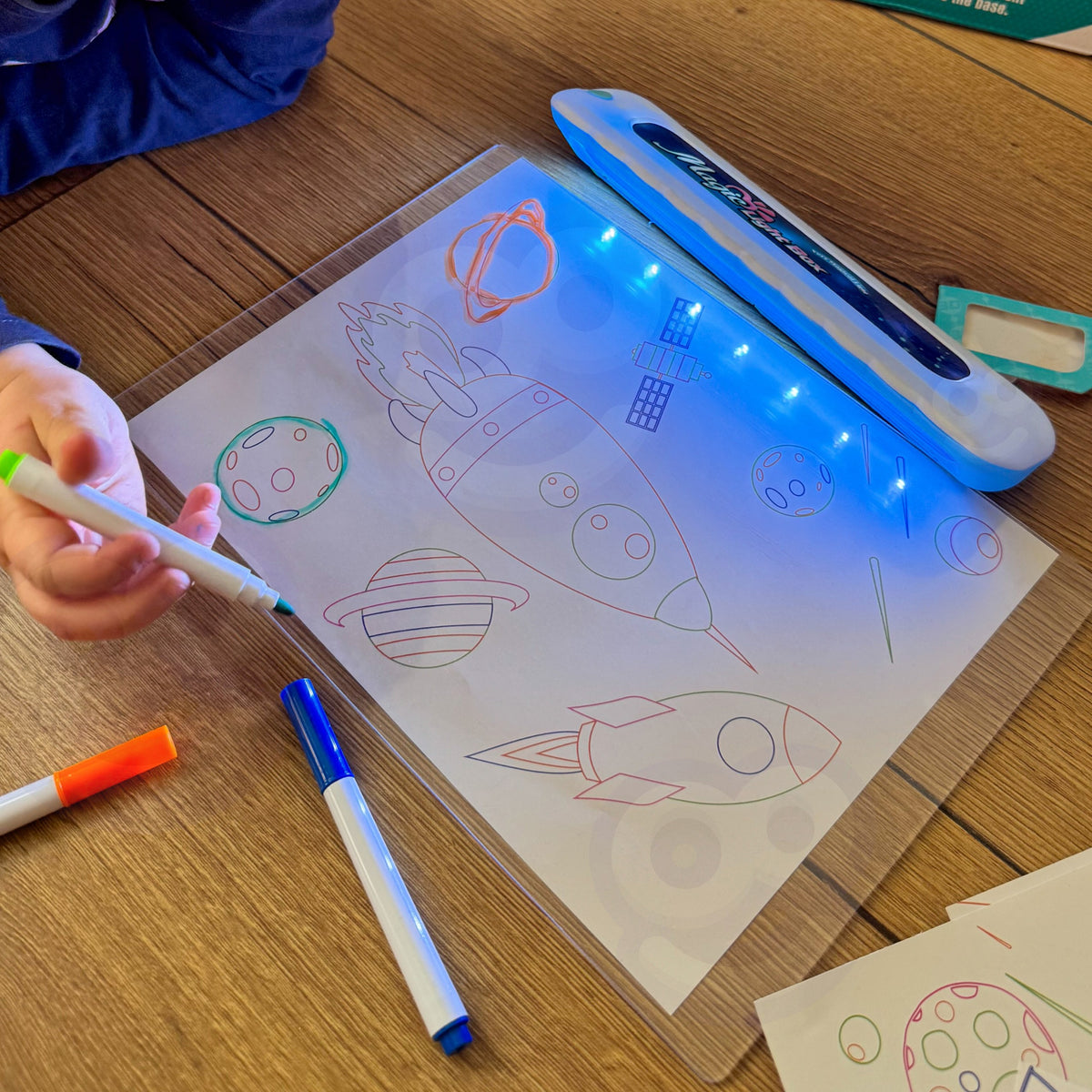 Glowing drawings on the board in the dark