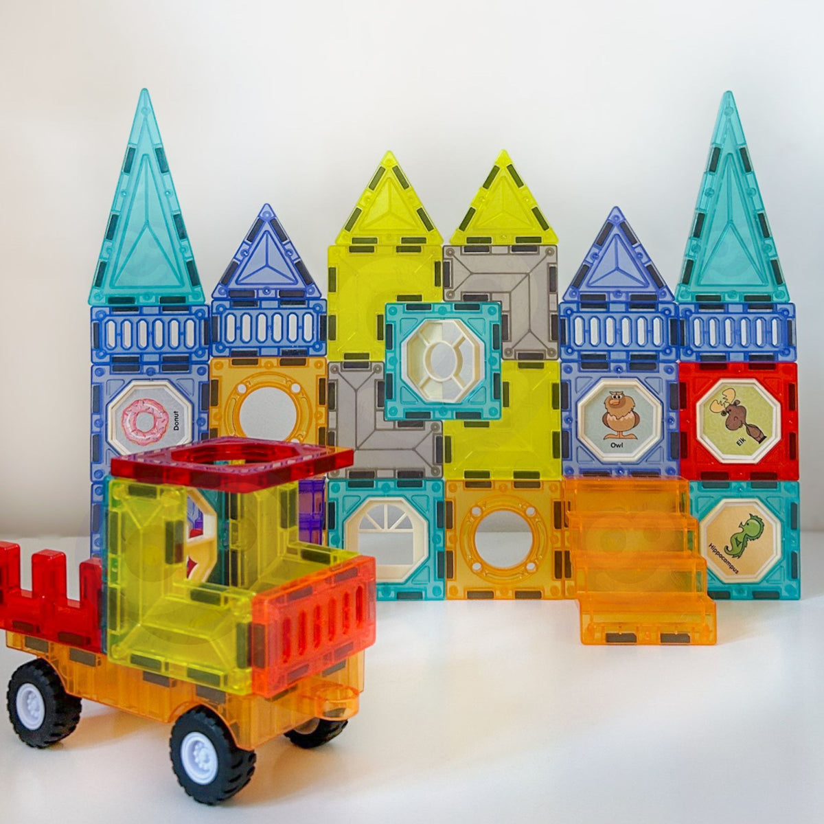 Magnetic tile car on a wheel base with stickers