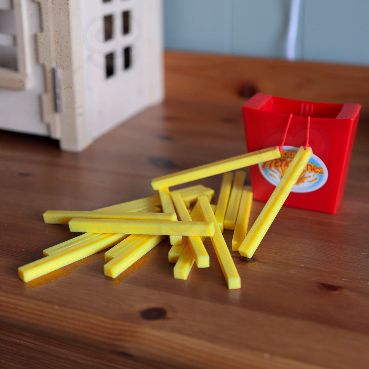 Child carefully pulling a fry from the box