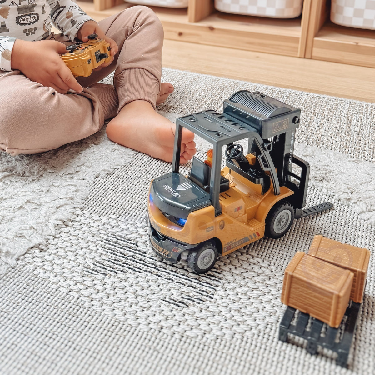 RC forklift with lights on and forks raised