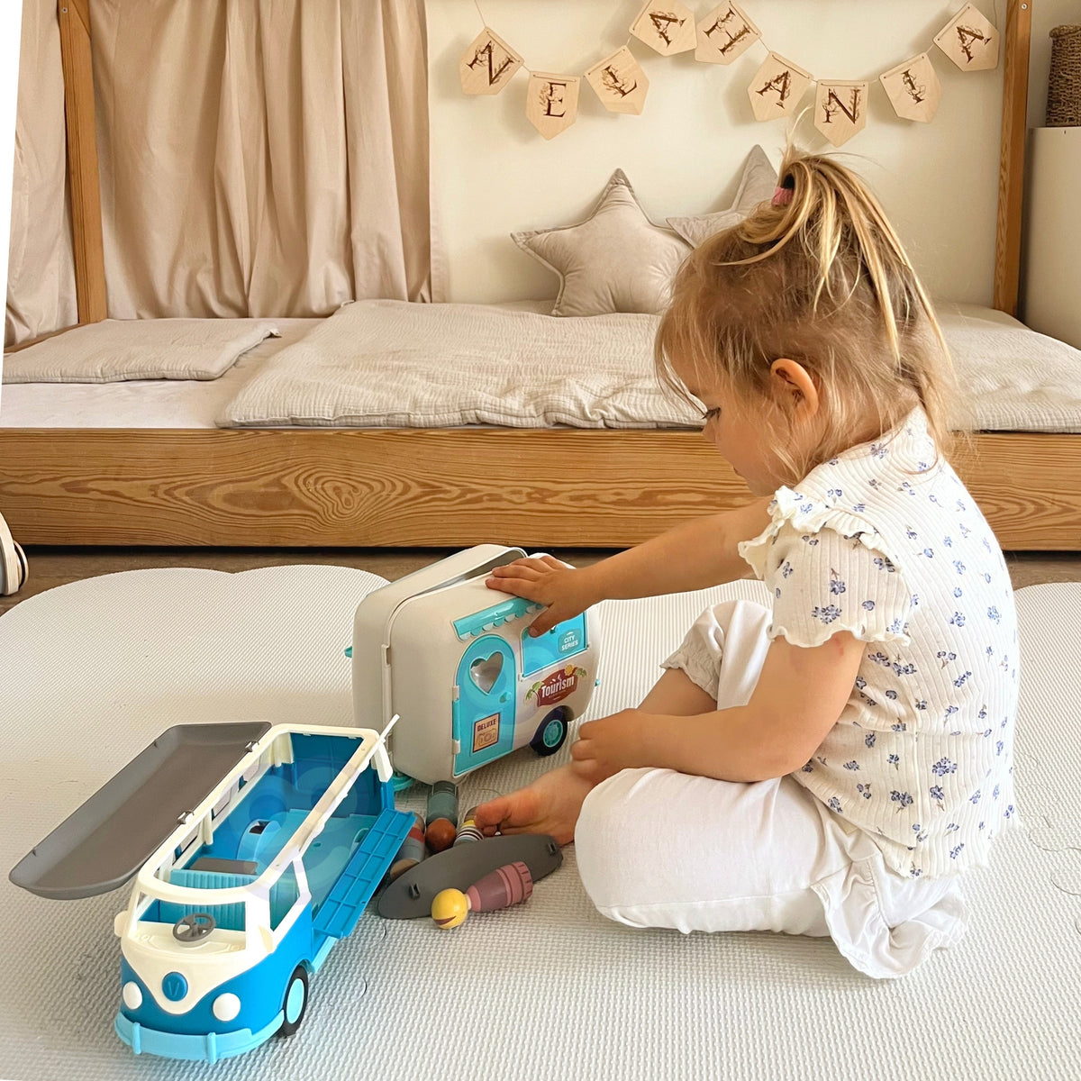 Retro camper with opening roof and surfboard