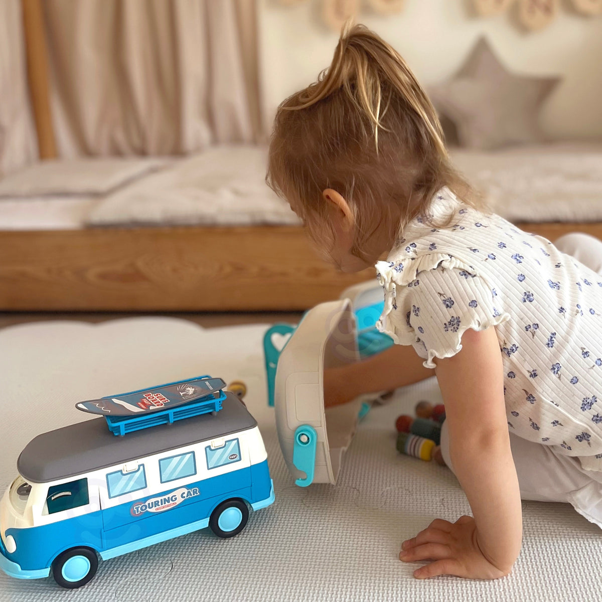 Toy camper trailer opened to show the interior